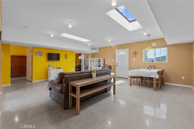 living room featuring a skylight