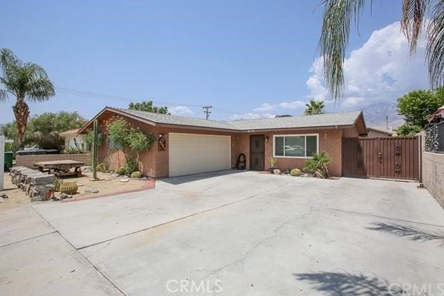 ranch-style home with a garage