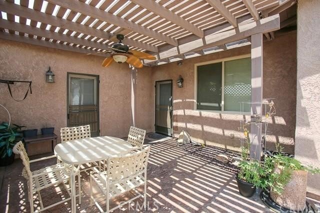 view of patio featuring a pergola and ceiling fan