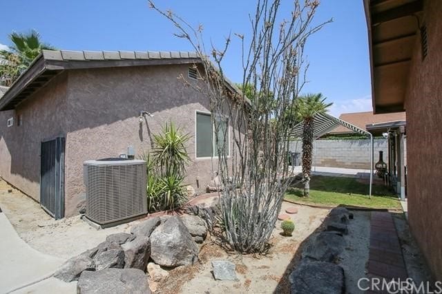 view of home's exterior featuring central AC