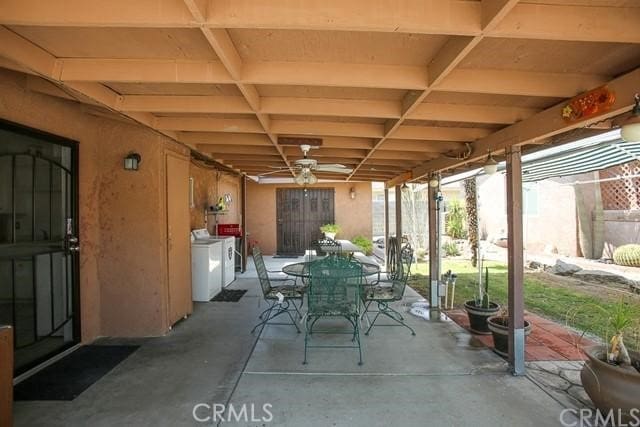 view of patio with washing machine and dryer