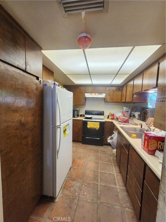 2763 US Highway 111, Imperial, CA 92251 - kitchen featuring electric stove, sink, and white fridge