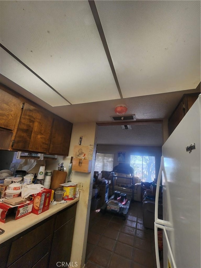 2763 US Highway 111, Imperial, CA 92251 - kitchen featuring dark brown cabinets and white fridge