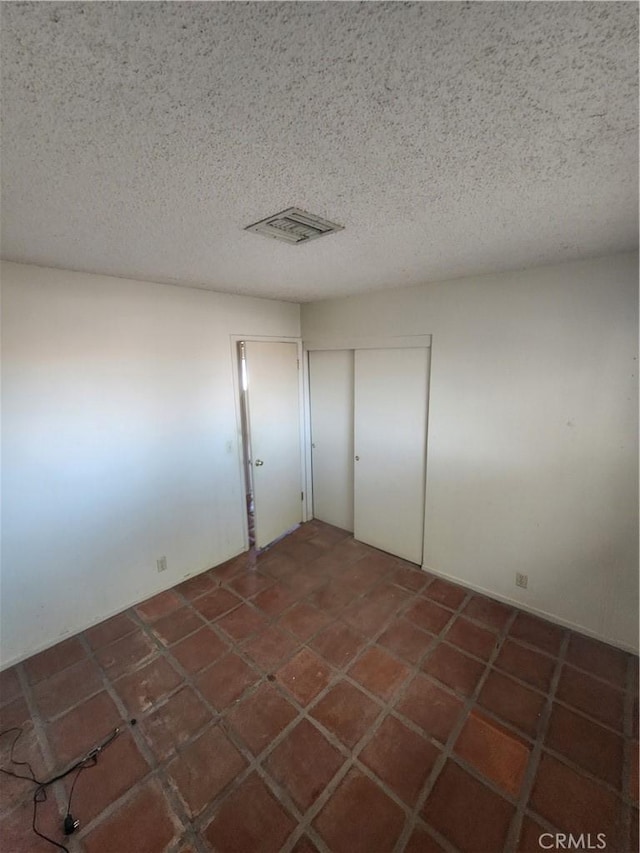 2763 US Highway 111, Imperial, CA 92251 - unfurnished bedroom featuring a textured ceiling and a closet