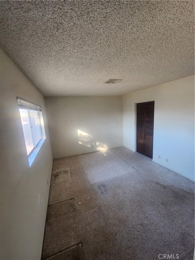 2763 US Highway 111, Imperial, CA 92251 - unfurnished room with carpet flooring and a textured ceiling