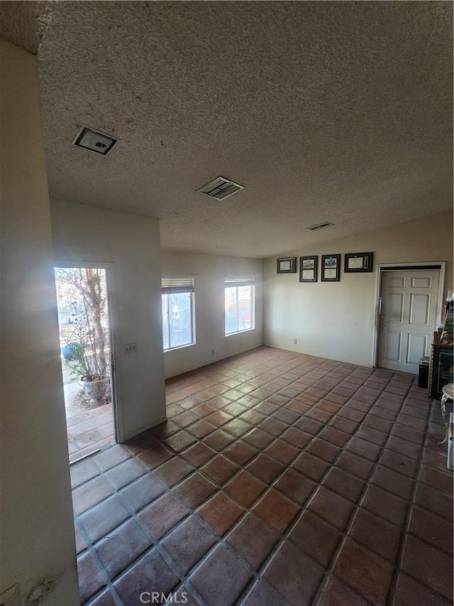 2763 US Highway 111, Imperial, CA 92251 - empty room featuring dark tile patterned flooring and a textured ceiling