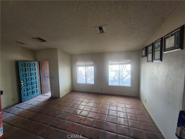 2763 US Highway 111, Imperial, CA 92251 - tiled spare room with a textured ceiling