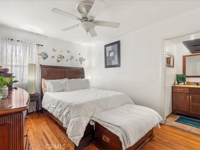 bedroom with ceiling fan and light hardwood / wood-style floors