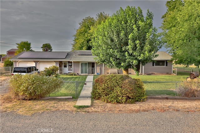 view of front of property with a front yard, solar panels, and a porch