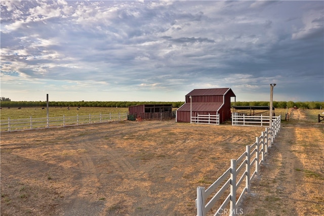 exterior space with a rural view and an outdoor structure