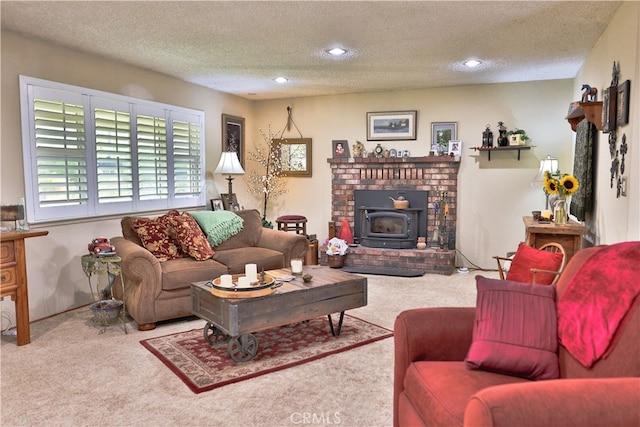 carpeted living room with a wood stove and a textured ceiling