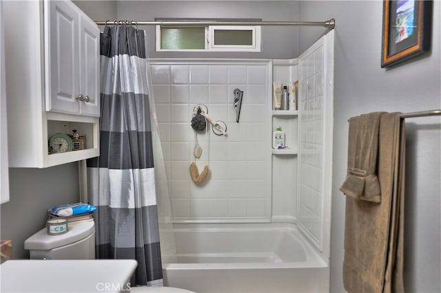 bathroom featuring toilet and shower / tub combo