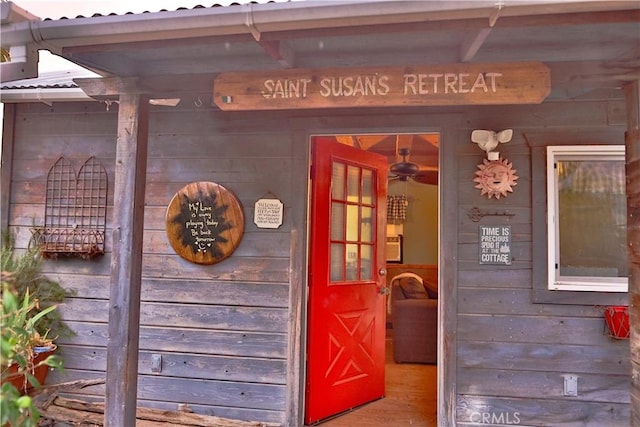 property entrance featuring metal roof