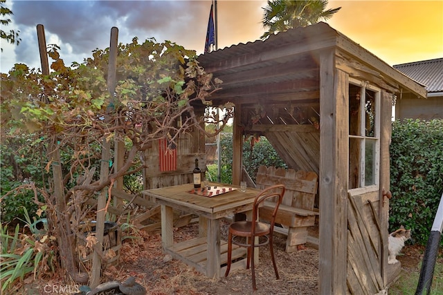 view of patio terrace at dusk