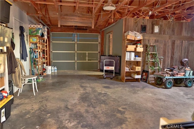 garage featuring wooden walls