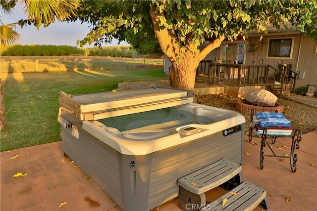 view of patio with a wooden deck and a hot tub