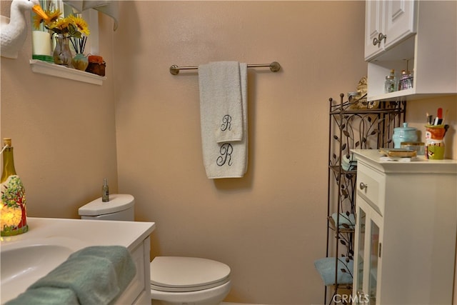 bathroom with toilet and vanity