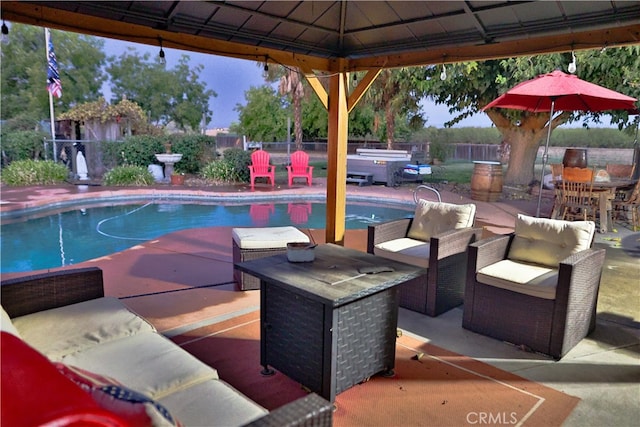 view of pool with a gazebo, an outdoor living space, a patio, and a jacuzzi