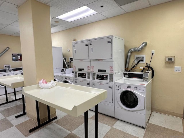 clothes washing area featuring washing machine and dryer and stacked washer and dryer