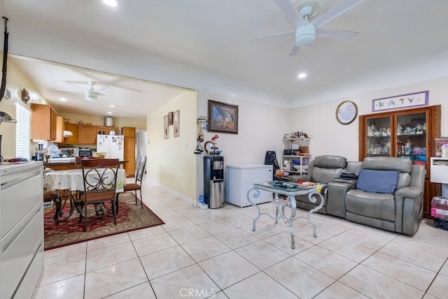 living room with light tile patterned floors and ceiling fan