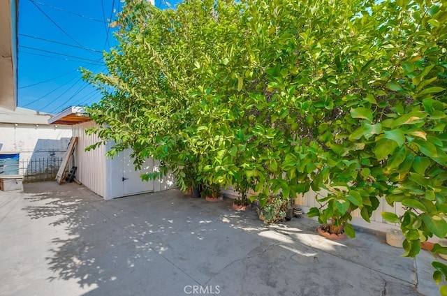 view of property exterior with a patio