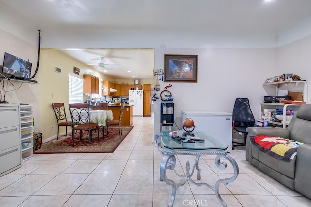 living room featuring ceiling fan and light tile patterned floors