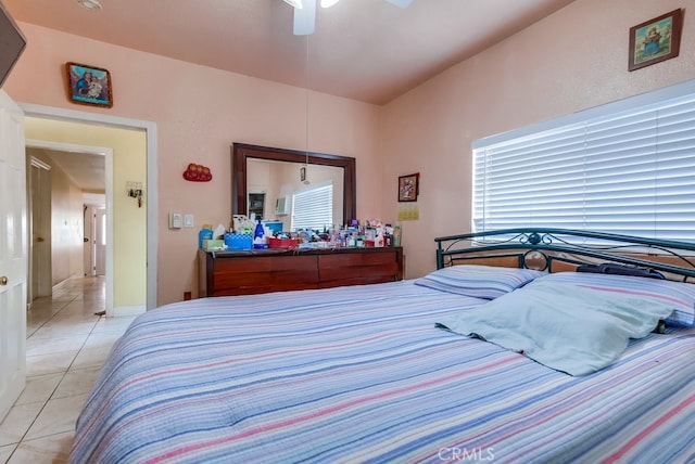 bedroom featuring ceiling fan and light tile patterned floors