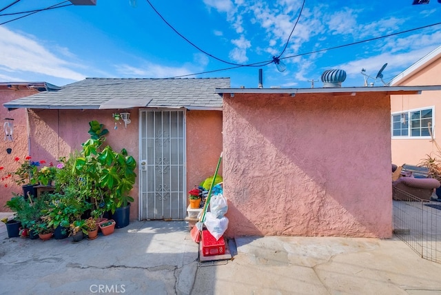 entrance to property with a patio area