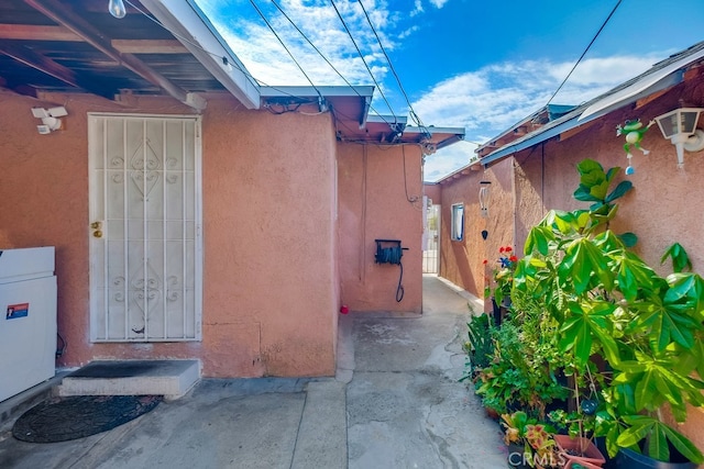 view of side of home featuring a patio area