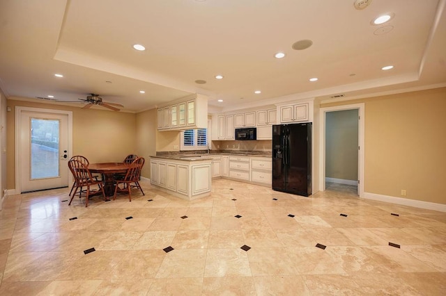 kitchen featuring crown molding, a tray ceiling, black appliances, and ceiling fan