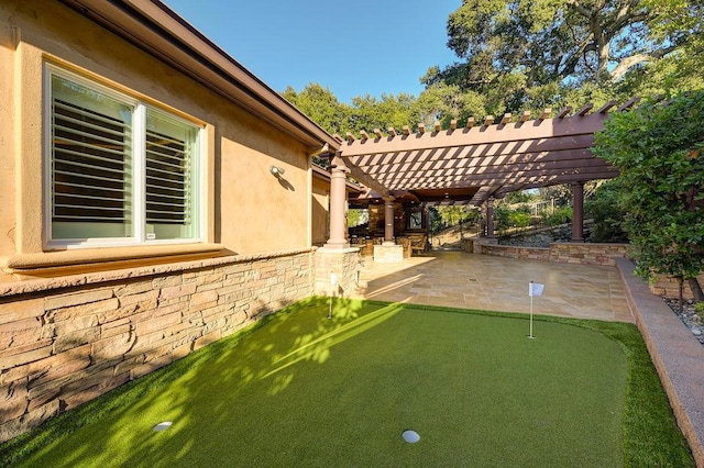 view of yard with a pergola and a patio