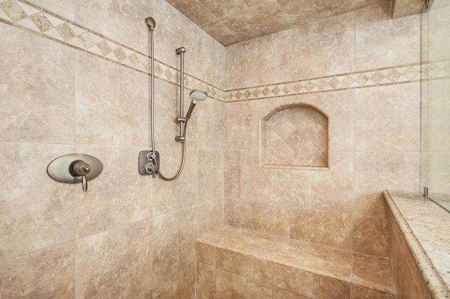 bathroom featuring tiled shower