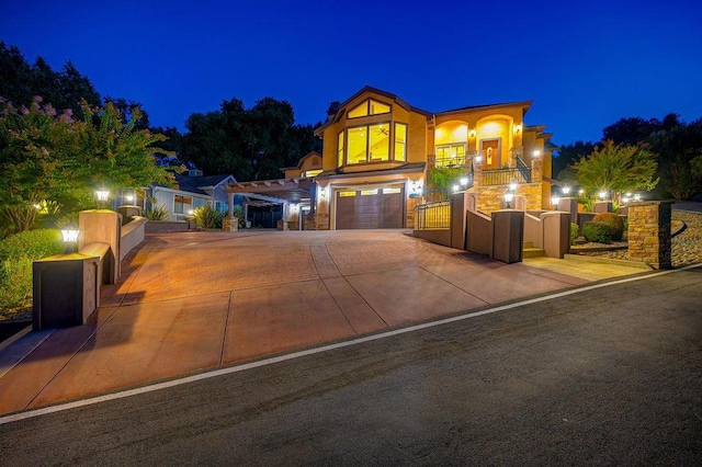 view of front of home with a balcony and a garage