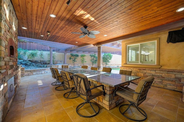 view of patio with a bar and ceiling fan