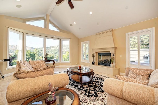 living room featuring a tile fireplace and vaulted ceiling with beams