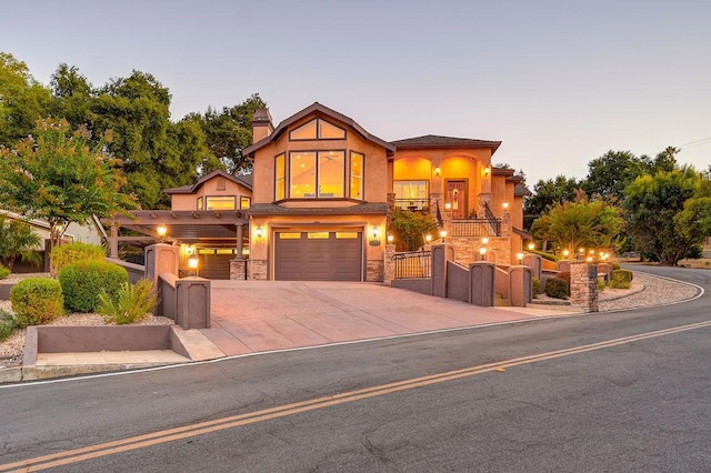 view of front of property featuring a garage and a balcony