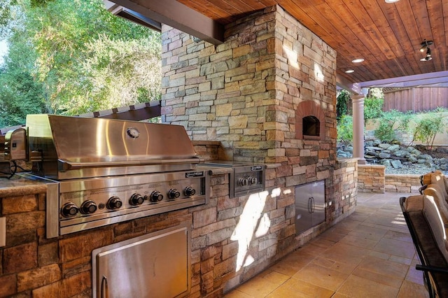 view of patio with exterior kitchen and area for grilling