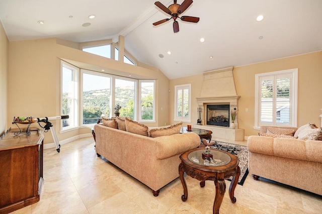 living room with lofted ceiling with beams, a large fireplace, and ceiling fan