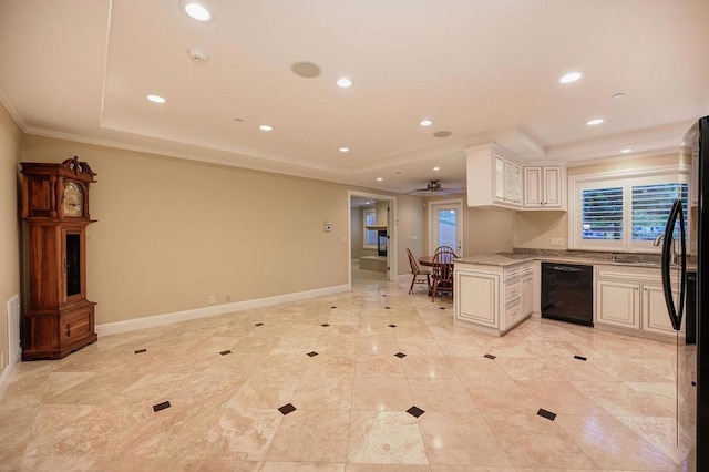 kitchen with white cabinetry, ornamental molding, black appliances, kitchen peninsula, and a raised ceiling