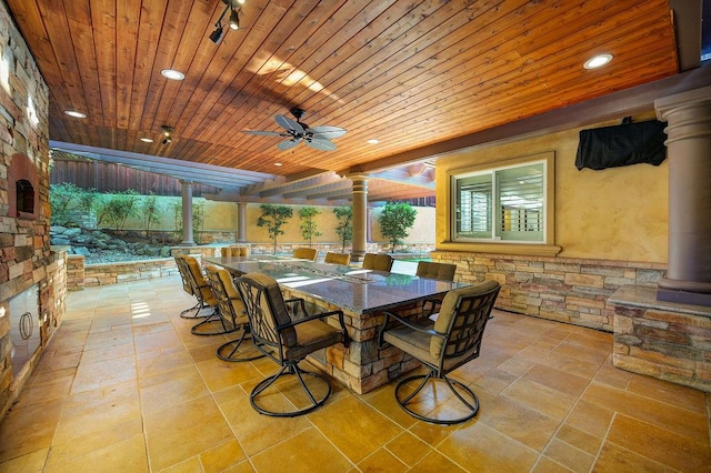 view of patio / terrace featuring ceiling fan and a bar