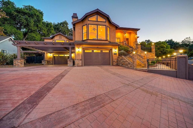 view of front of home featuring a carport and a garage