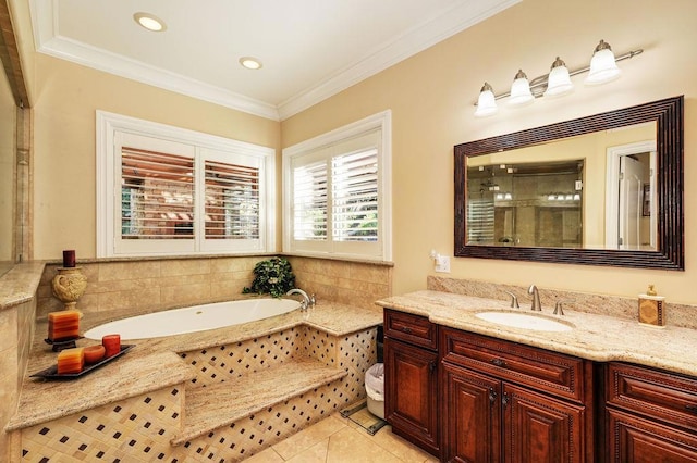 bathroom with crown molding, tile patterned floors, a relaxing tiled tub, and vanity