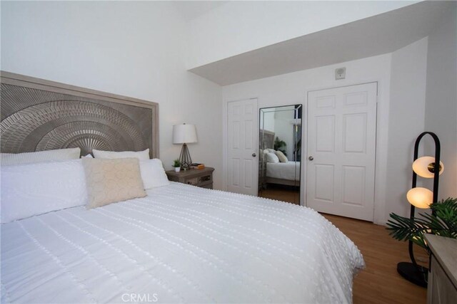 bedroom featuring wood-type flooring