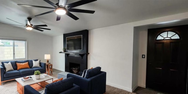 carpeted living room with lofted ceiling, ceiling fan, and a fireplace