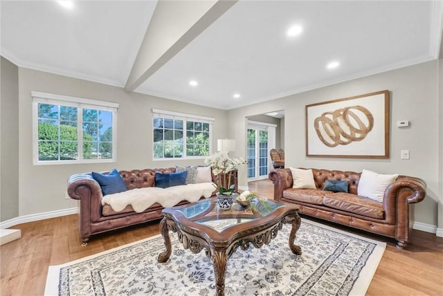 living room with light wood-type flooring, vaulted ceiling, and crown molding