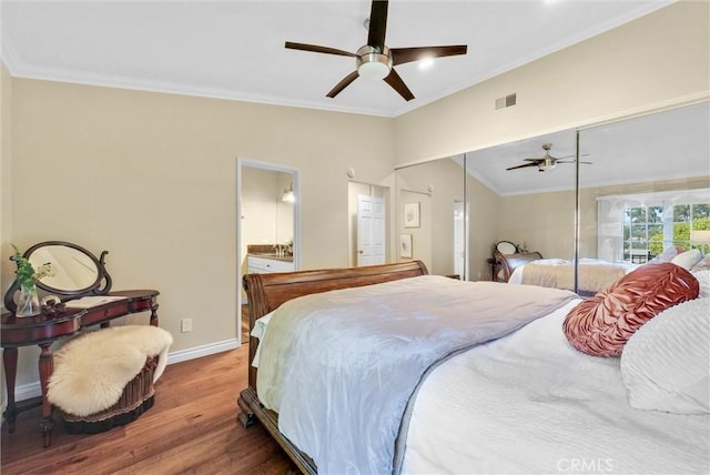 bedroom with ensuite bathroom, ceiling fan, ornamental molding, wood-type flooring, and a closet