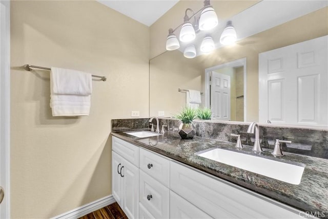 bathroom featuring tasteful backsplash, vanity, and hardwood / wood-style flooring