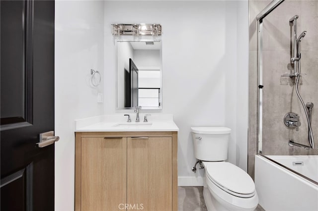 full bathroom featuring vanity, toilet, and bath / shower combo with glass door