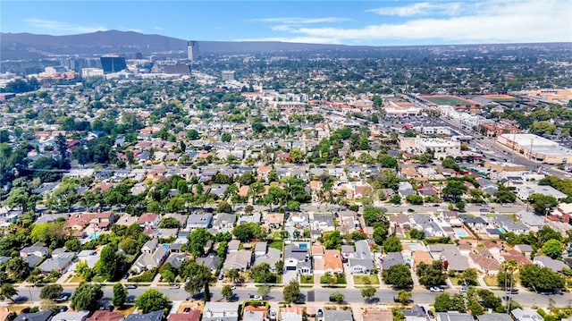 birds eye view of property with a mountain view