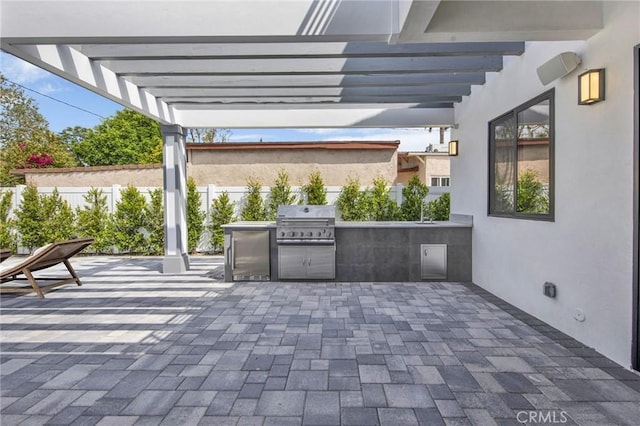 view of patio / terrace with a grill, area for grilling, and a pergola